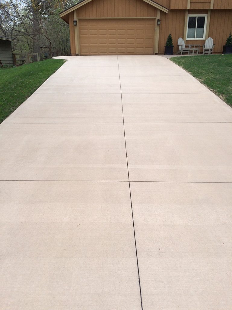 Wide Tan Concrete Driveway